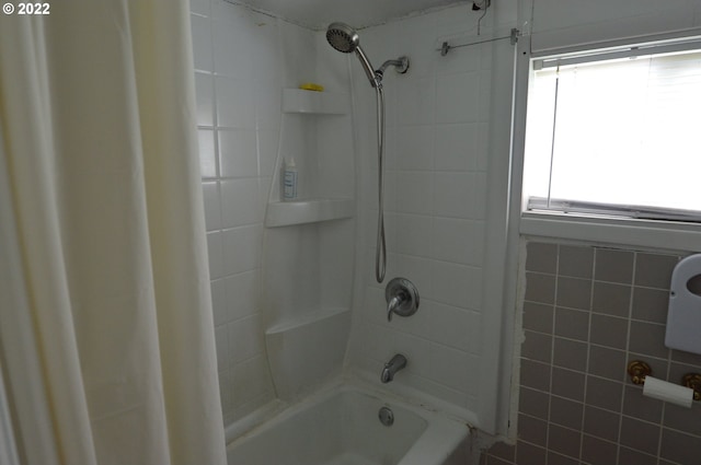 full bathroom with shower / tub combo