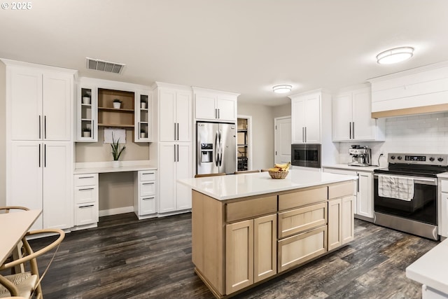 kitchen with white cabinetry, a center island, stainless steel appliances, dark hardwood / wood-style flooring, and decorative backsplash