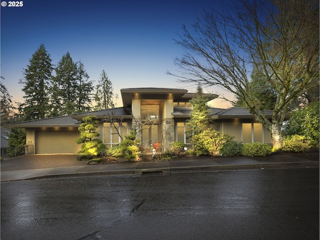 prairie-style house featuring a garage