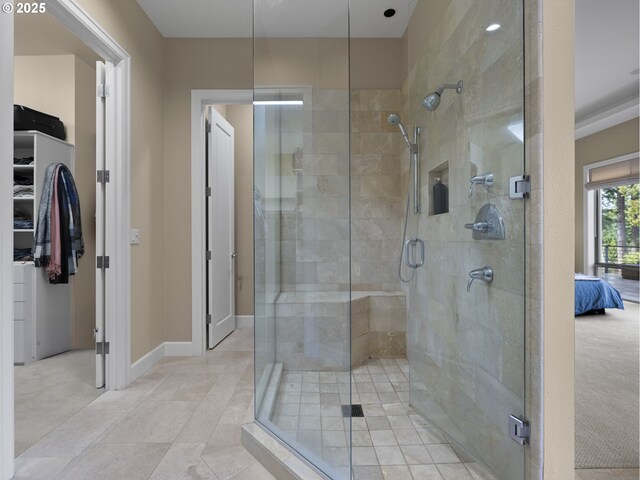 bathroom featuring tile patterned flooring and a shower with door