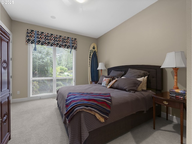 bedroom featuring light carpet