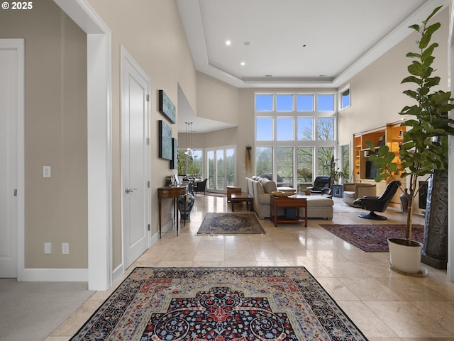 living room with light tile patterned floors and a towering ceiling