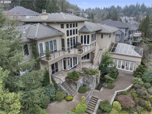 rear view of house with a lanai