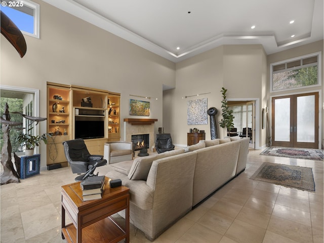 living room featuring a high ceiling and french doors