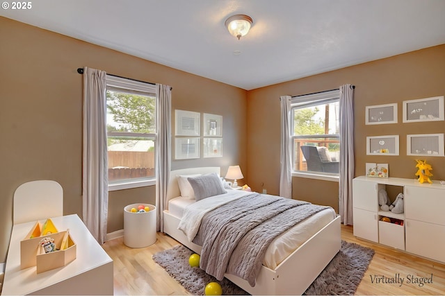 504 NW Fargo St, Camas, WA 98607 - bedroom with multiple windows and light wood-type flooring