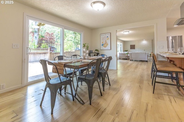 435 E 53rd Ave, Eugene, OR 97405 - dining room with light wood-style flooring, plenty of natural light, and a textured ceiling