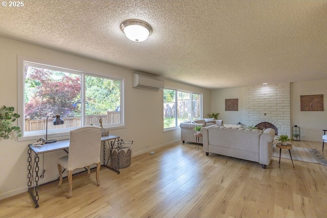 435 E 53rd Ave, Eugene, OR 97405 - living room with a wall mounted air conditioner, a textured ceiling, light wood-type flooring, and a brick fireplace
