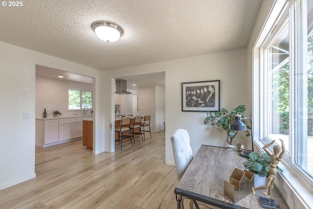 435 E 53rd Ave, Eugene, OR 97405 - dining area with a textured ceiling and light wood-style flooring