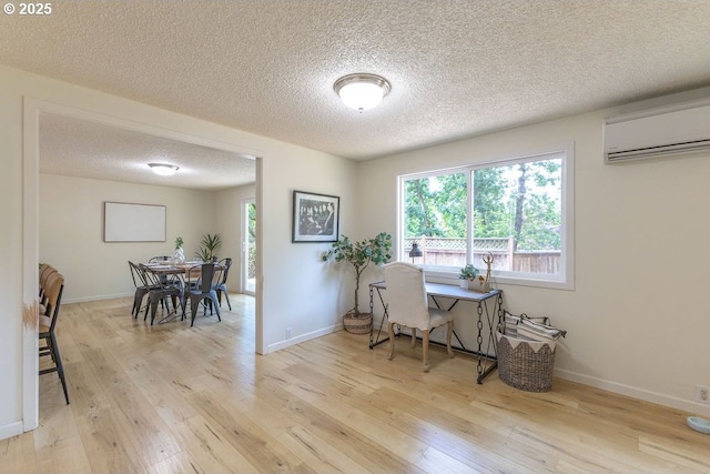 435 E 53rd Ave, Eugene, OR 97405 - office space featuring a wall mounted air conditioner, a textured ceiling, and light wood finished floors