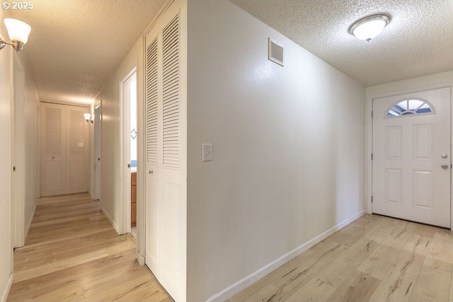 435 E 53rd Ave, Eugene, OR 97405 - foyer entrance with a textured ceiling and light wood finished floors