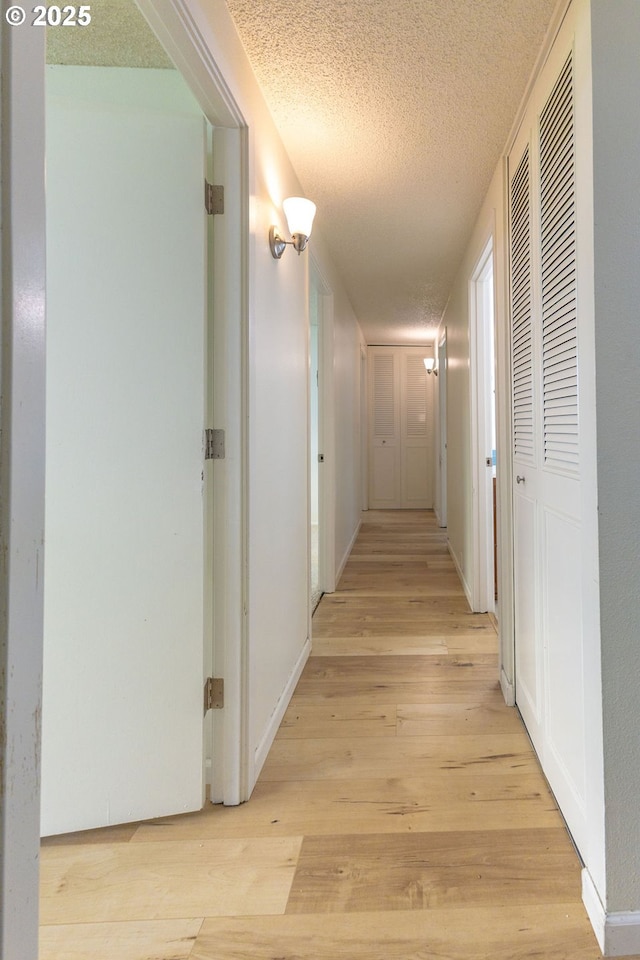 435 E 53rd Ave, Eugene, OR 97405 - hall with a textured ceiling and light wood-style flooring
