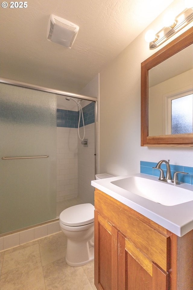 435 E 53rd Ave, Eugene, OR 97405 - full bathroom featuring vanity, a shower stall, and tile patterned flooring