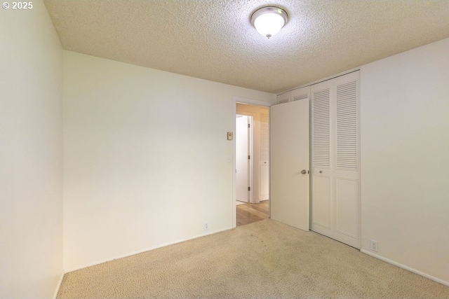 435 E 53rd Ave, Eugene, OR 97405 - unfurnished bedroom with carpet floors, a closet, and a textured ceiling