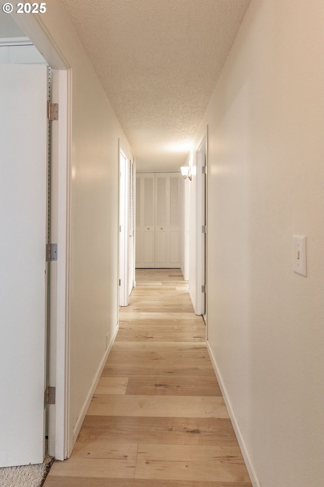 435 E 53rd Ave, Eugene, OR 97405 - corridor with a textured ceiling and light wood-style floors