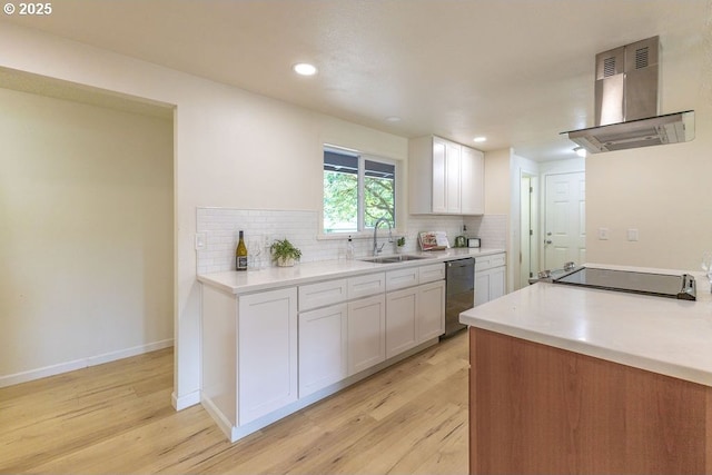 435 E 53rd Ave, Eugene, OR 97405 - kitchen featuring stainless steel dishwasher, wall chimney range hood, light wood-style floors, tasteful backsplash, and recessed lighting