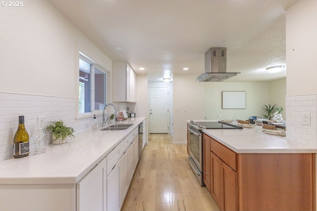 435 E 53rd Ave, Eugene, OR 97405 - kitchen with electric stove, ventilation hood, white cabinetry, backsplash, and recessed lighting