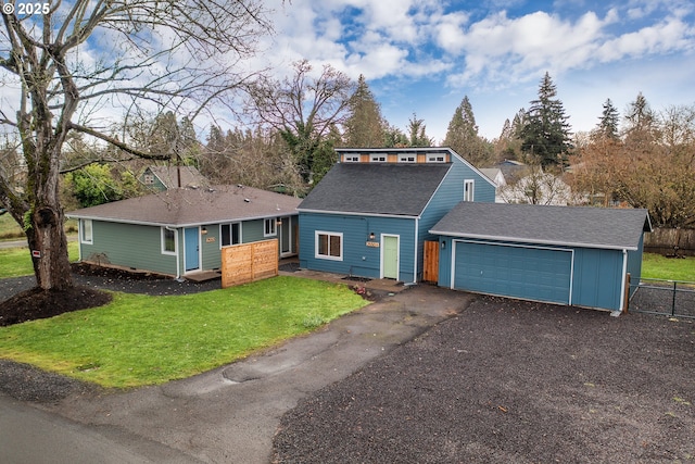 view of front of house featuring a front lawn and a garage