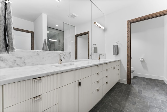 bathroom with vanity and toilet