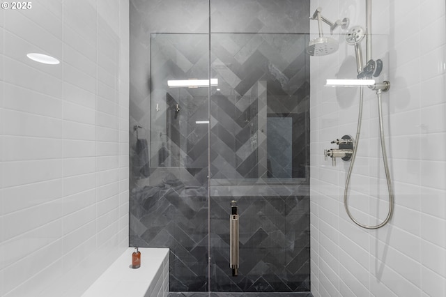 bathroom with a shower with shower door