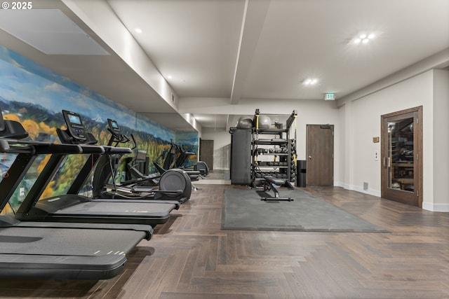 workout area featuring dark parquet flooring