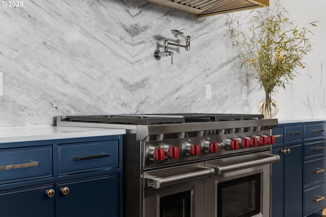 details featuring blue cabinetry and double oven range