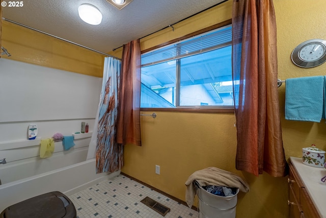 5383 Sunshine Rd, Roseburg, OR 97470 - full bathroom with visible vents, baseboards, shower / tub combo, a textured ceiling, and vanity