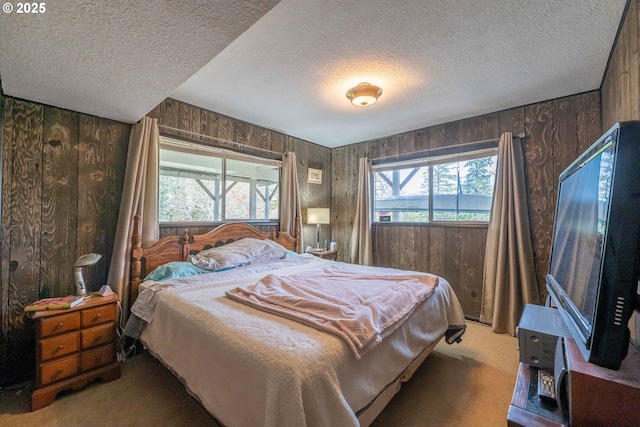 5383 Sunshine Rd, Roseburg, OR 97470 - bedroom featuring wooden walls, light carpet, and a textured ceiling