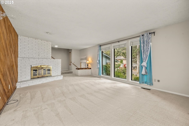 16620 SE Ladd Ct, Milwaukie, OR 97267 - unfurnished living room featuring carpet flooring, a fireplace, and stairs