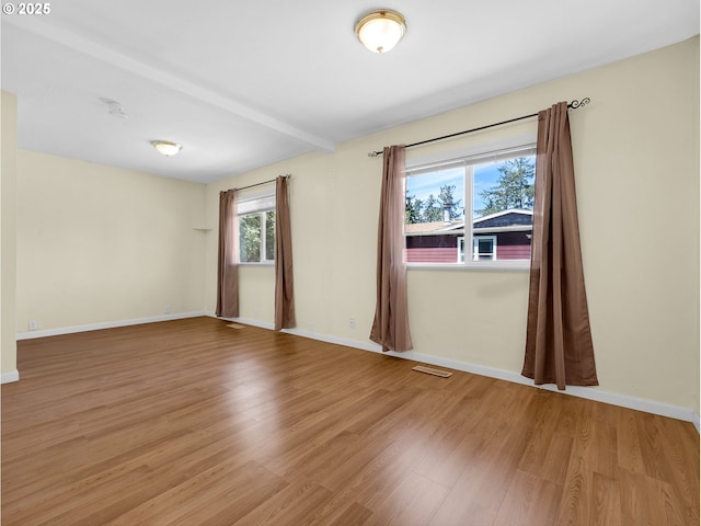 125 SW Cedar Ave, Warrenton, OR 97146 - empty room featuring wood finished floors and baseboards