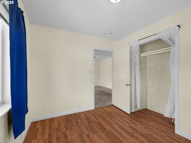 125 SW Cedar Ave, Warrenton, OR 97146 - unfurnished bedroom featuring wood finished floors and a closet