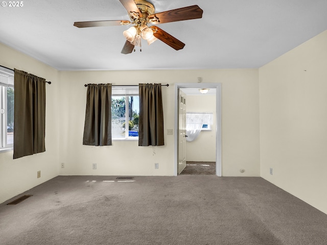 125 SW Cedar Ave, Warrenton, OR 97146 - carpeted empty room featuring a ceiling fan
