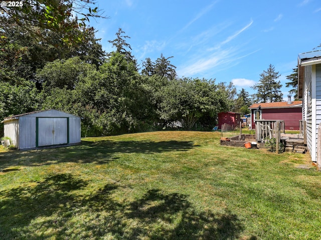 125 SW Cedar Ave, Warrenton, OR 97146 - view of grassy yard with a storage unit