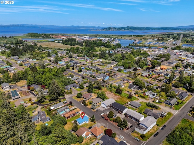 125 SW Cedar Ave, Warrenton, OR 97146 - aerial overview of property's location with a nearby body of water and nearby suburban area