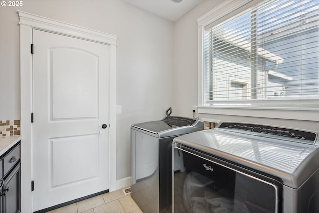 132 N 39th Ct, Ridgefield, WA 98642 - laundry area with independent washer and dryer and light tile patterned floors