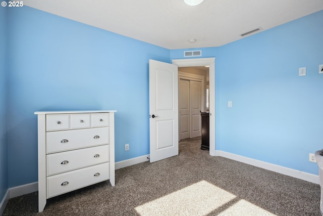 132 N 39th Ct, Ridgefield, WA 98642 - unfurnished bedroom featuring baseboards and dark carpet