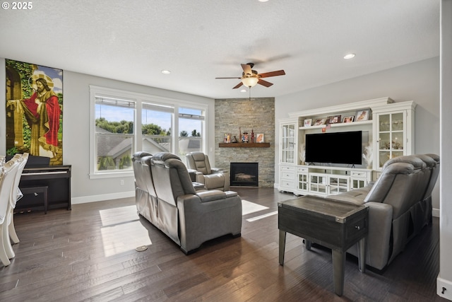 132 N 39th Ct, Ridgefield, WA 98642 - living area featuring a ceiling fan, a stone fireplace, dark wood finished floors, and recessed lighting