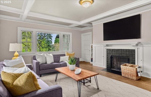 1965 SW Montgomery Pl, Portland, OR 97201 - living area featuring coffered ceiling, wood finished floors, a tile fireplace, beamed ceiling, and crown molding
