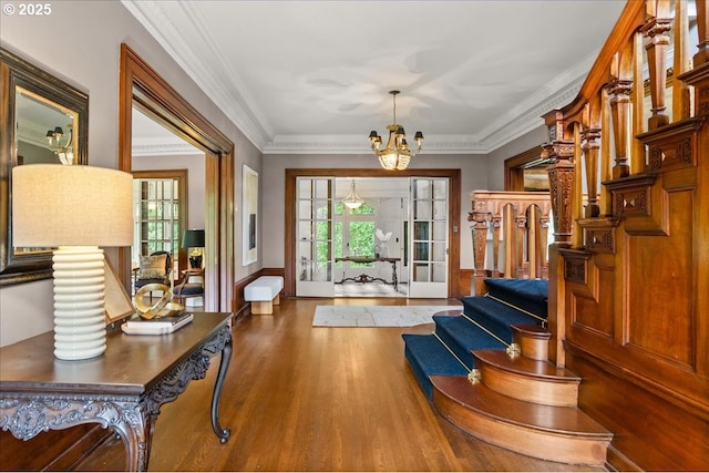 1965 SW Montgomery Pl, Portland, OR 97201 - foyer entrance featuring a chandelier, wood finished floors, plenty of natural light, stairs, and crown molding