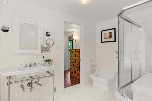 1965 SW Montgomery Pl, Portland, OR 97201 - bathroom with tile walls, a stall shower, tile patterned flooring, and wainscoting