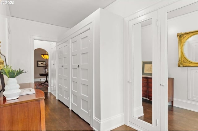 1965 SW Montgomery Pl, Portland, OR 97201 - hallway featuring arched walkways, dark wood-type flooring, and baseboards