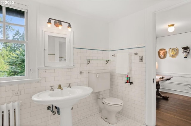 1965 SW Montgomery Pl, Portland, OR 97201 - bathroom with radiator, toilet, tile walls, and a wainscoted wall