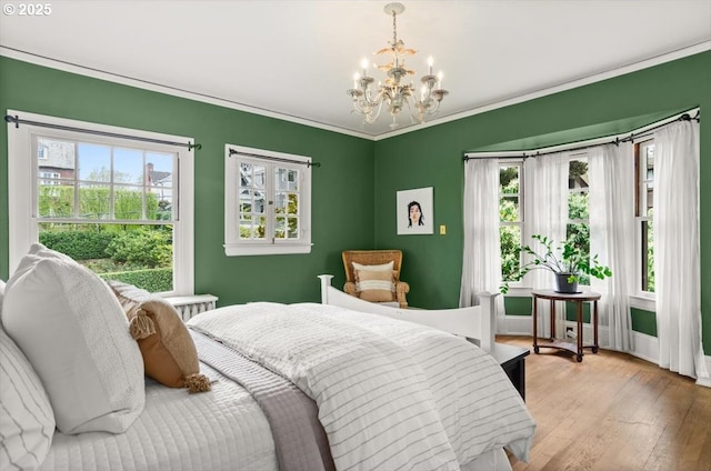 1965 SW Montgomery Pl, Portland, OR 97201 - bedroom with a chandelier, light wood-style flooring, and ornamental molding