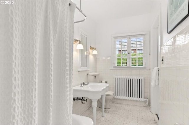 1965 SW Montgomery Pl, Portland, OR 97201 - full bathroom with radiator, curtained shower, toilet, tile walls, and wainscoting