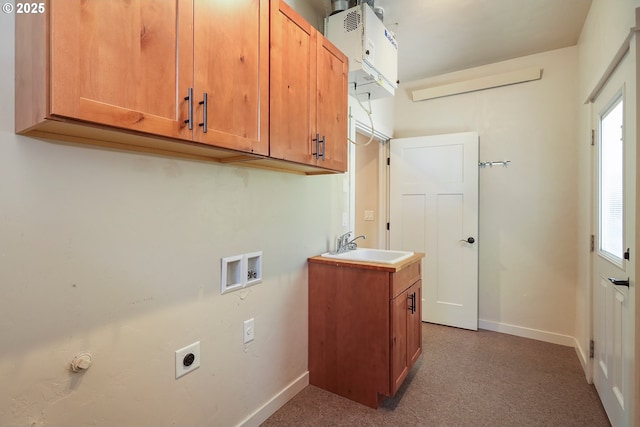 laundry area with baseboards, washer hookup, hookup for an electric dryer, and cabinet space