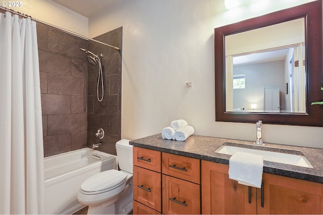 bathroom featuring toilet, shower / tub combo with curtain, and vanity