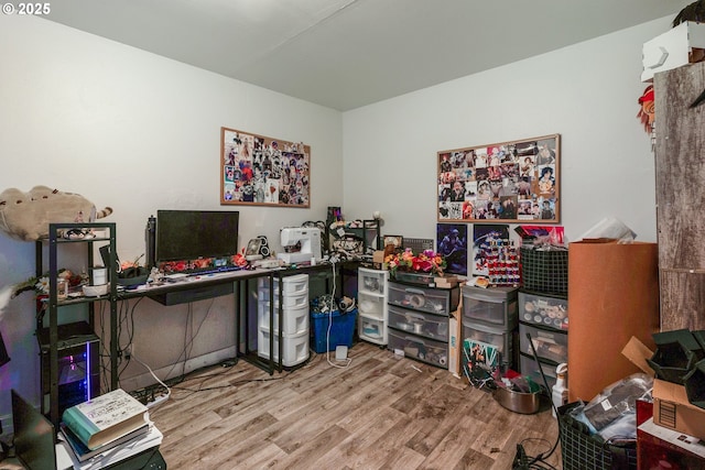 office area with light hardwood / wood-style floors