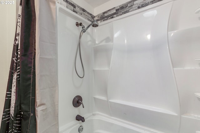 bathroom with shower / tub combo