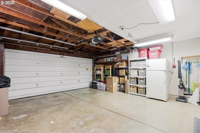 14797 SW Willamette St, Sherwood, OR 97140 - garage with freestanding refrigerator and a garage door opener