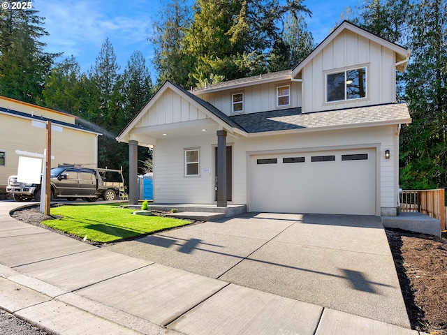 view of front facade with a garage and a front lawn