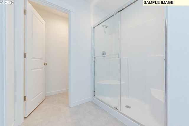 1496 NE Josephine Ct Unit 181, Estacada, OR 97023 - bathroom featuring a stall shower and baseboards